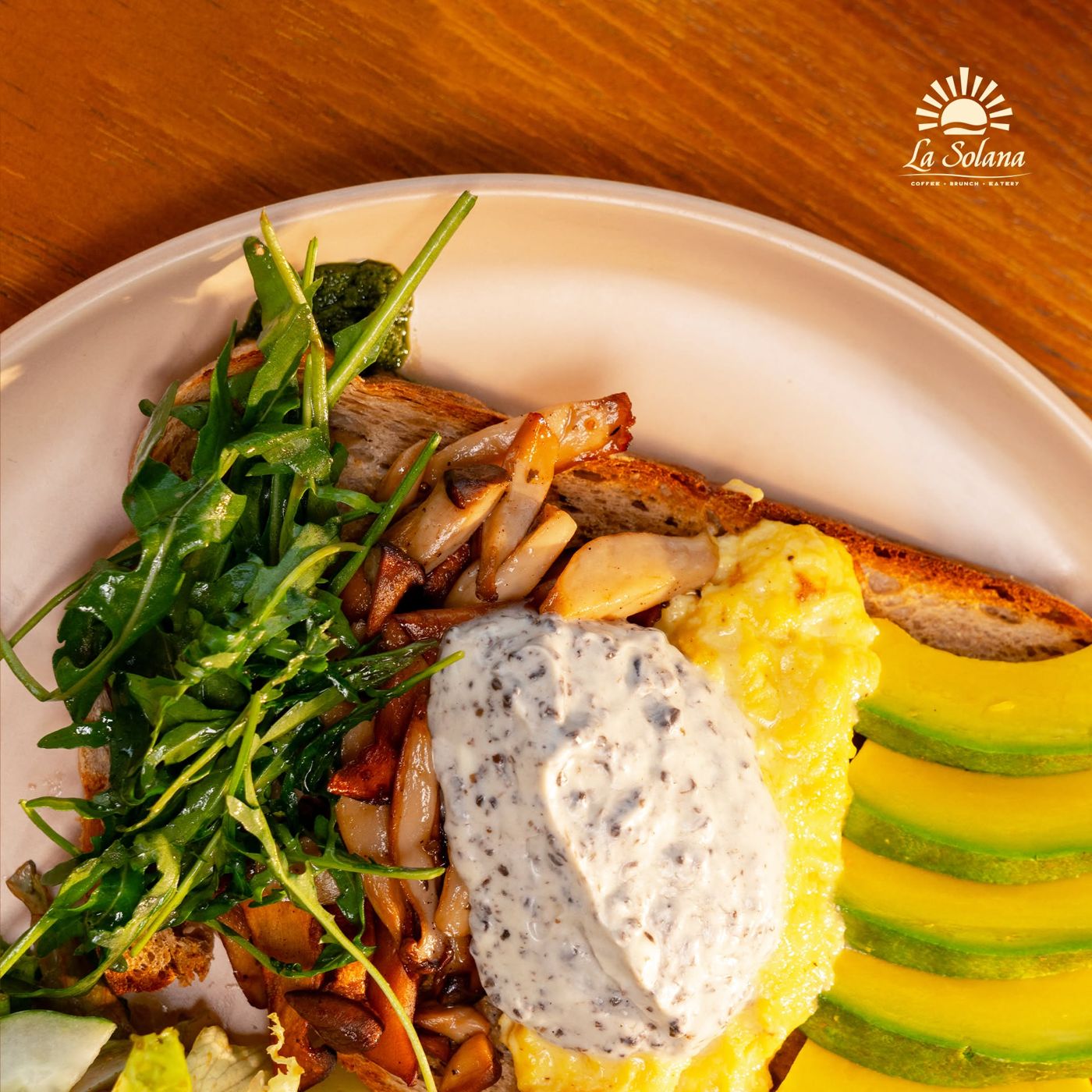 La Sol Garden Toast with scrambled egg, mushrooms, avocado and truffle cream on sourdough