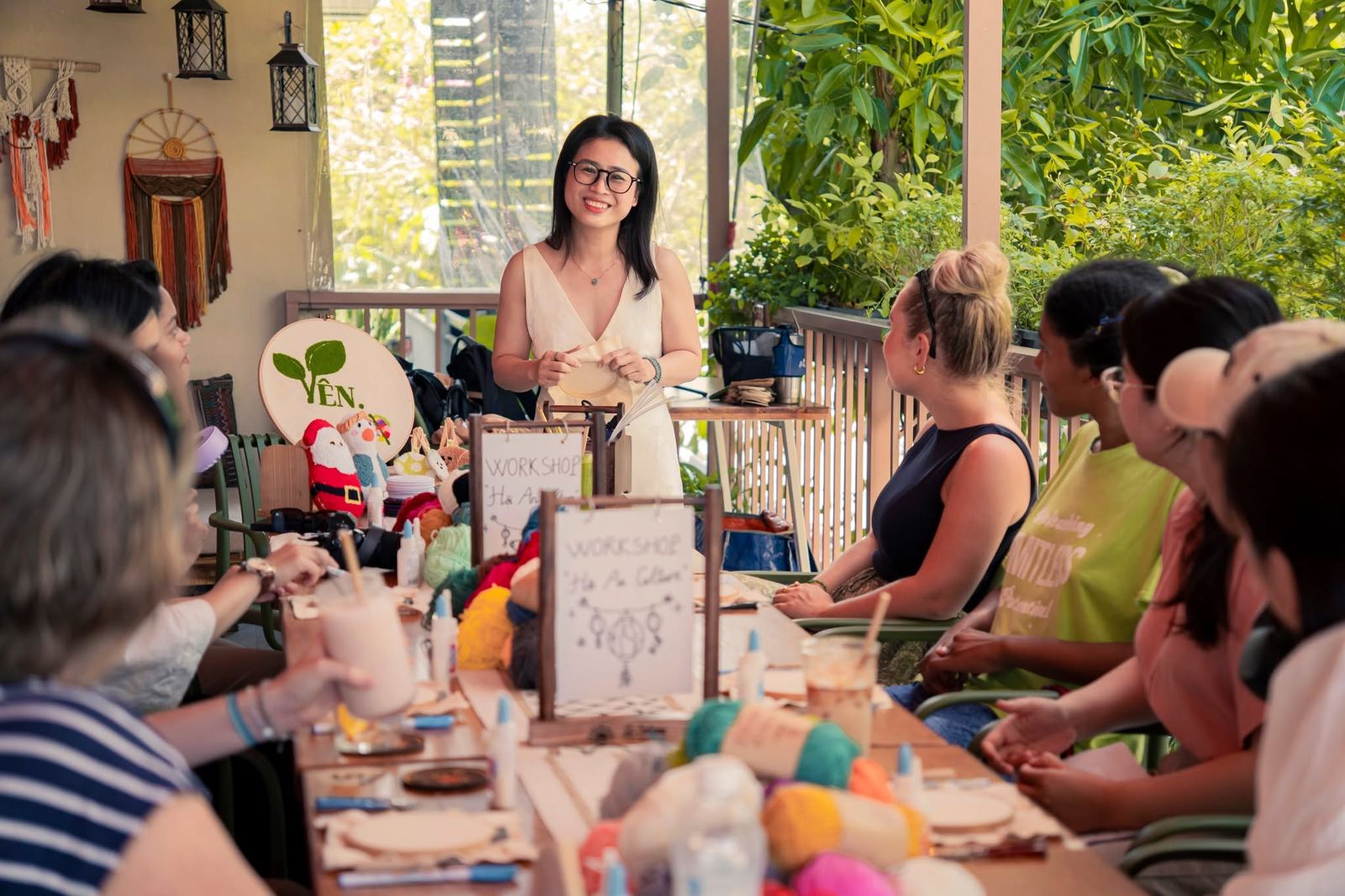 A Hội An culture embroidery workshop around a long table on the upstairs terrace