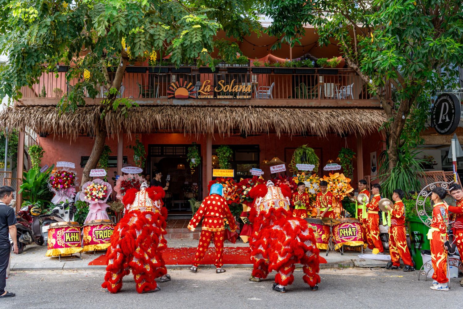 Lion dancers and flower stands at the La Solana entrance on opening day